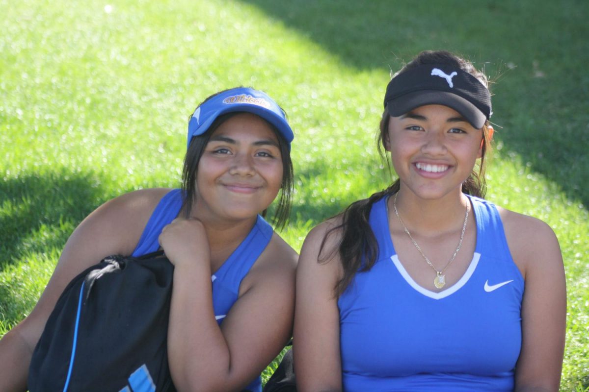 Zughei Guzman and Arelie Paz waiting for their game to start.