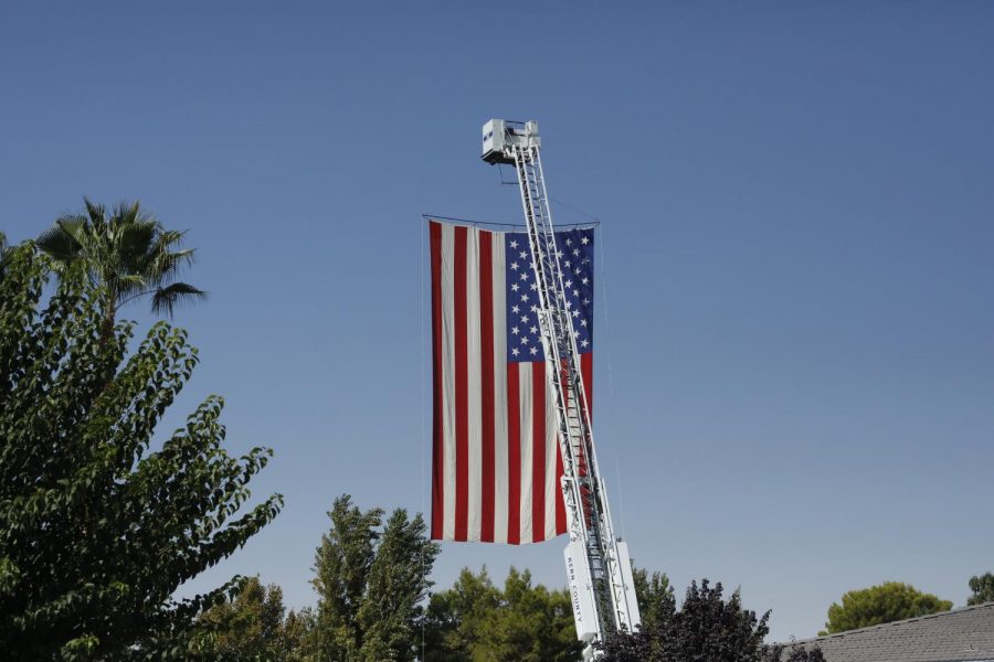 Firefighters raised the American Flag high in the air above the WSRPD center during Kelsey Meadowss memorial services.