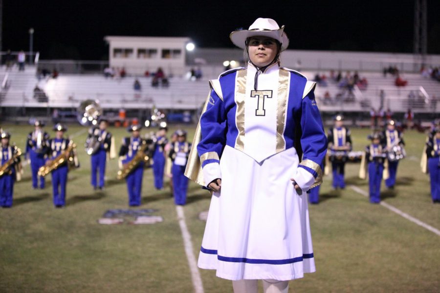 Drum Major Angie Self prepares to conduct the band.