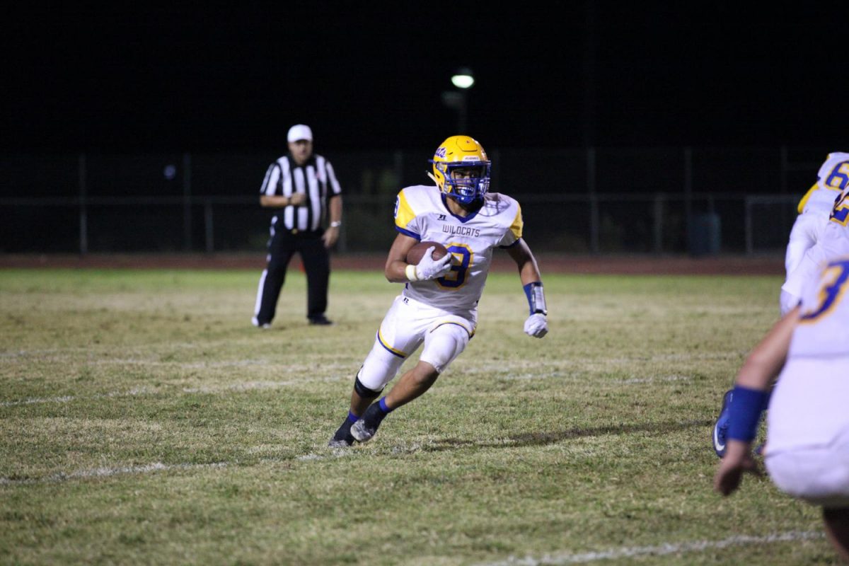 After receiving the ball, Fano Maui rushes forward.