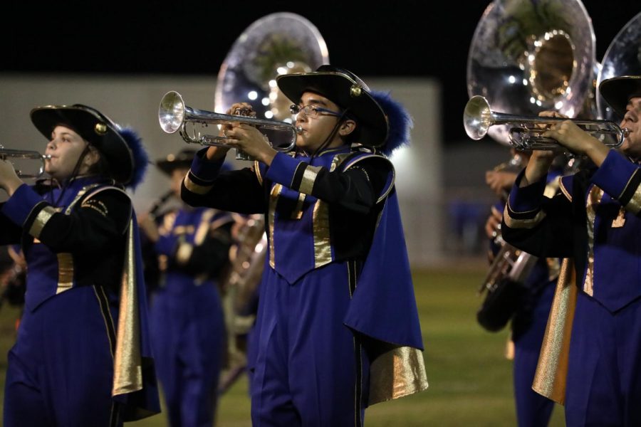 Dominic Krier and other band members preforming at the half time show.