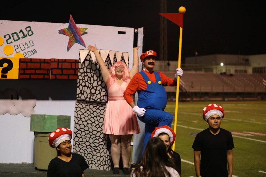 Abel Lopez rescued Princess Peach, Jenna Yarbrough, from a baby Thunderbird on the Senior class float.
