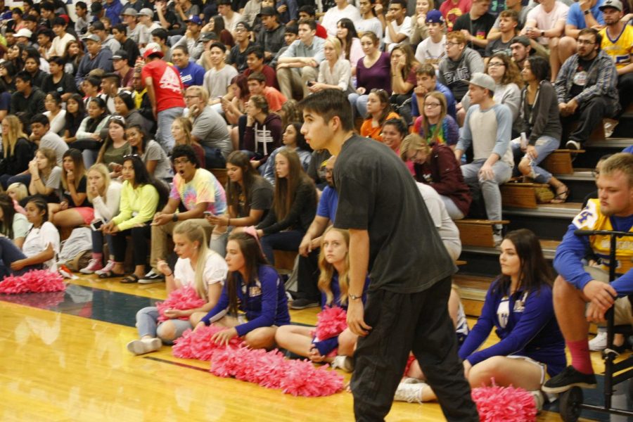 Brennan Rodriguez raced to get the photos of the theme songs during one of the games.