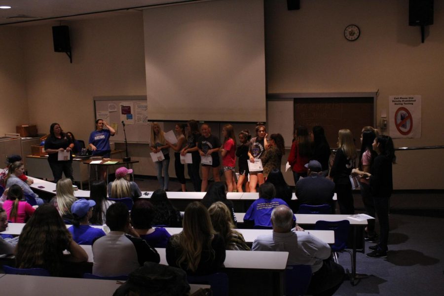 Coach White passing out awards to her team. 