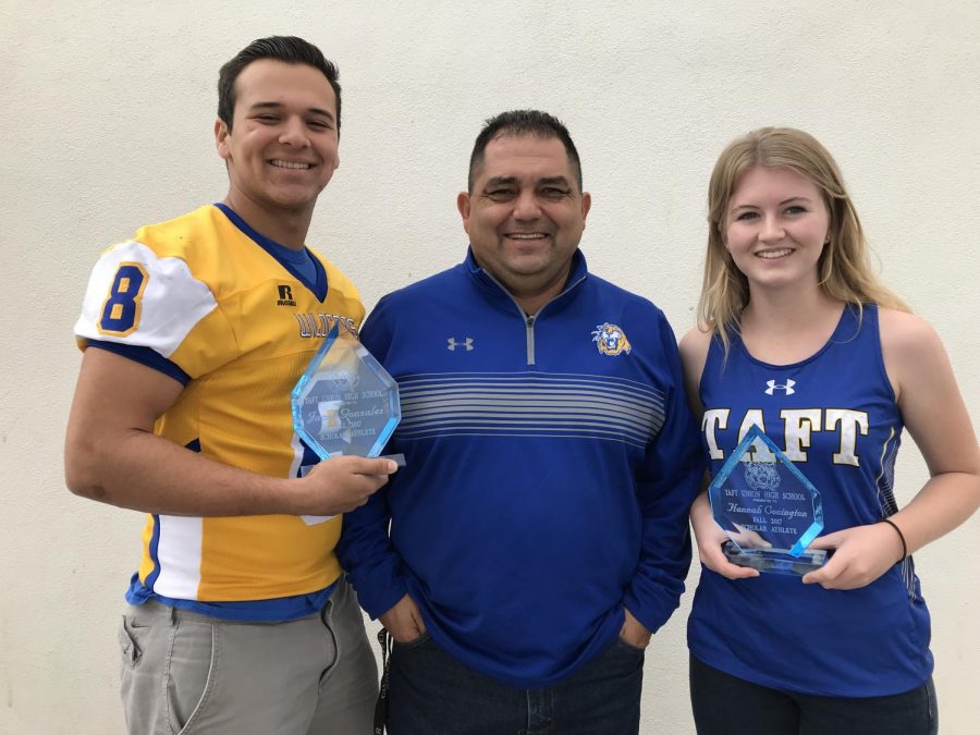 Jacob Gonzales and Hannah Covington receive fall scholar-athlete awards from Athletic Director Pete Lango.
