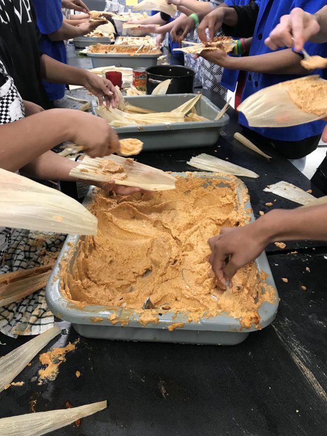 Students working together to make tamales