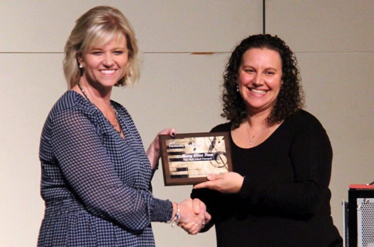 Mary Alice Finn is given her award by Amanda Issac, KCMEA president for Outstanding Administrator.