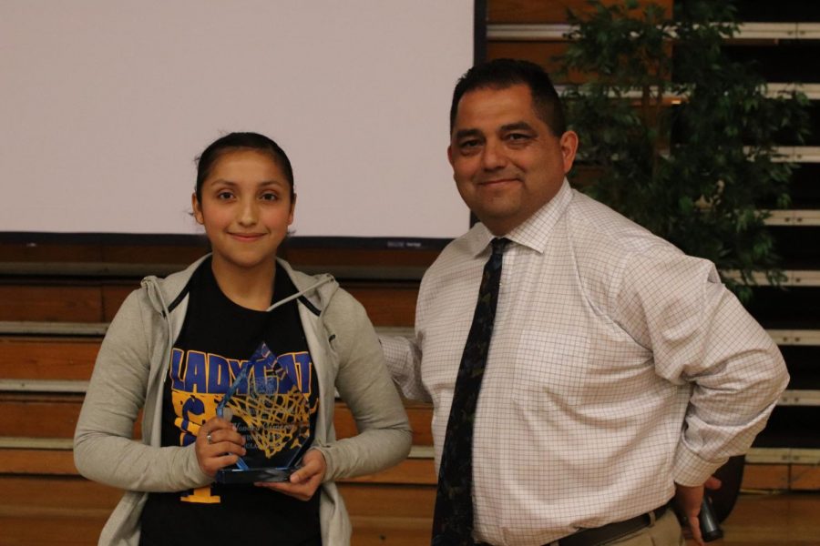 Alondra Cisneros receiving her Academic Scholar Athlete award.