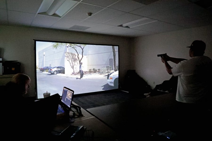 Tom White uses the simulator to teach Christian Burleson to control the situation.