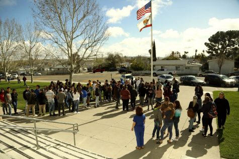 Students gathered outside the school on Wednesday to pray for peace.