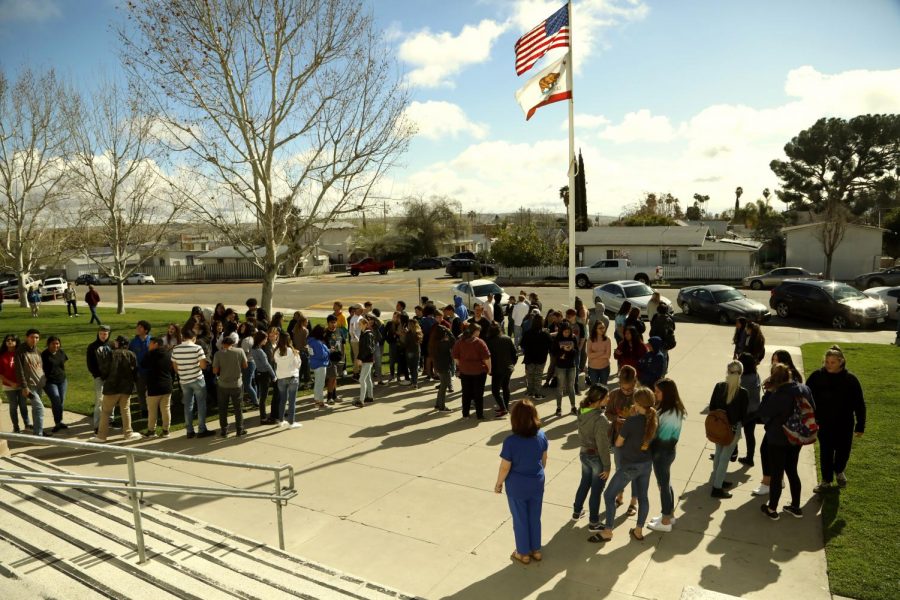 Students+gathered+outside+the+school+on+Wednesday+to+pray+for+peace.