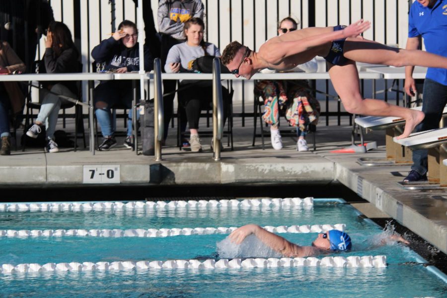 Sophomore, Zane Martin, diving into the 4 by 200 medley relay. 