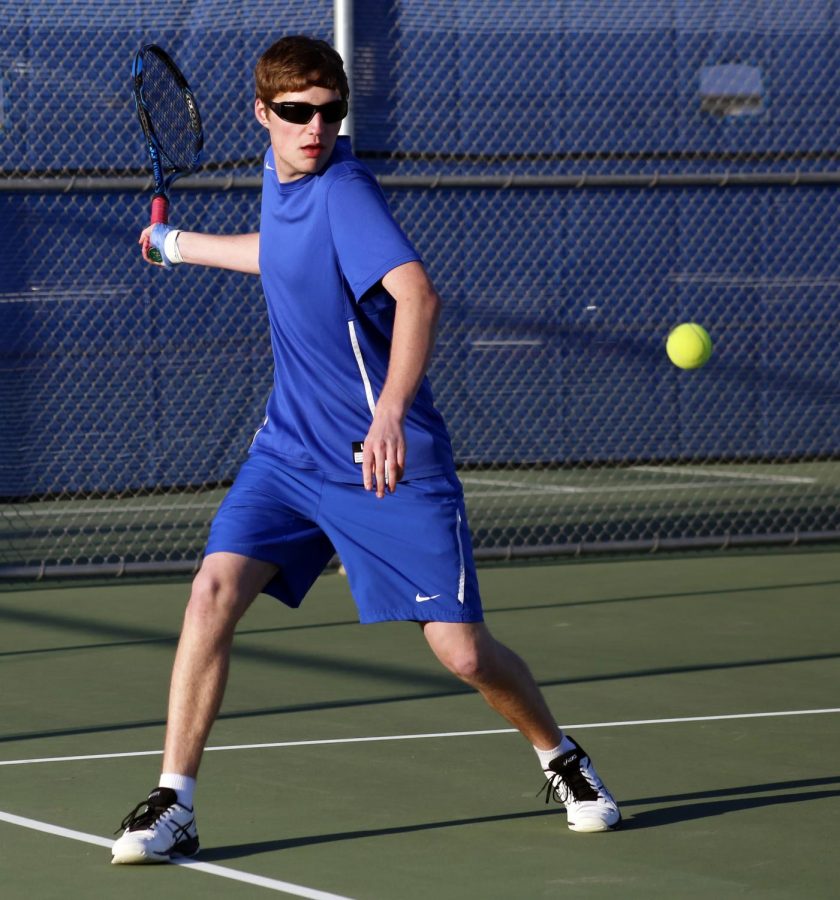 Sawyer Maier returns a forehand in his doubles win against Frontier there Tuesday. He won his singles and doubles matches.