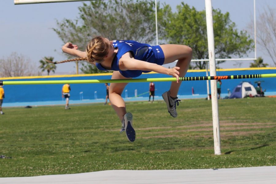 Caitlin Bailey doing the high jump.