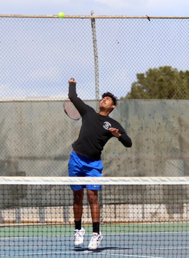 Enrique Reyes serving the ball. 