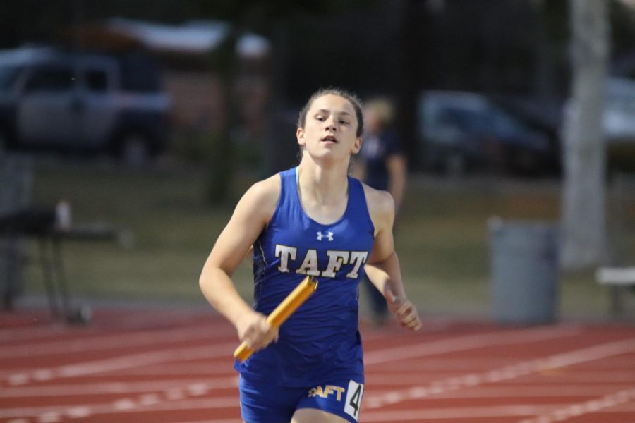 Bree Johansen running to the finish line during the 4x400-meter relay team at the Patriot Games.