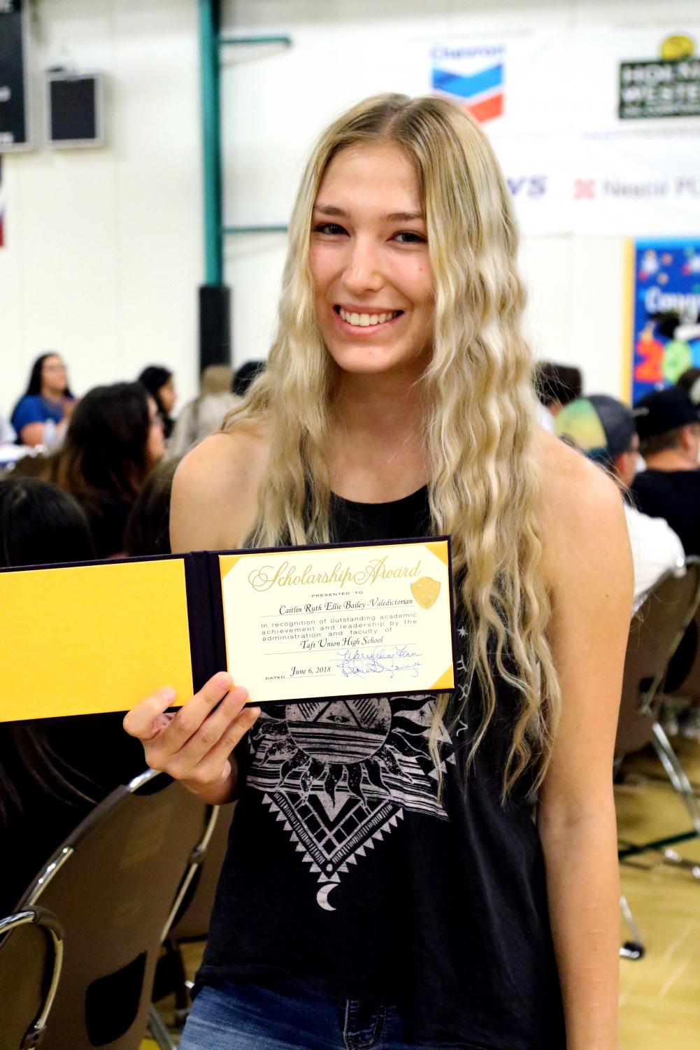 Caitlin Bailey received her certificate for achieving Valedictorian of the Class of 2018 with a G.P.A. of 4.37.