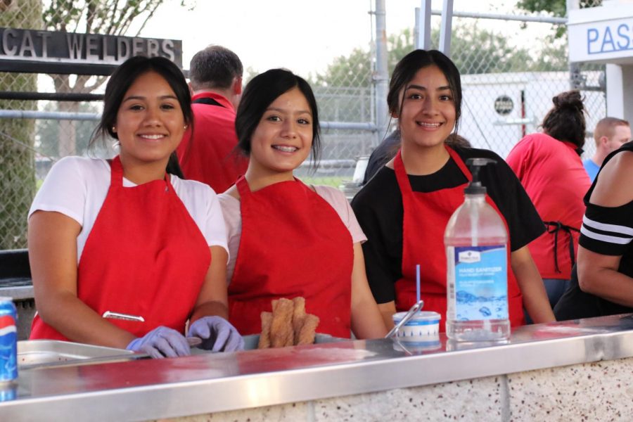 FCCLA members Litzy Lopez, Vanessa Carreno, and Erica Carrillo working the fundraiser during the football game Friday, August 24. FCCLA is run by the students, with Carlos Chavira as the Club Adviser. When asked about the fundraiser Chavira said, It was a success.