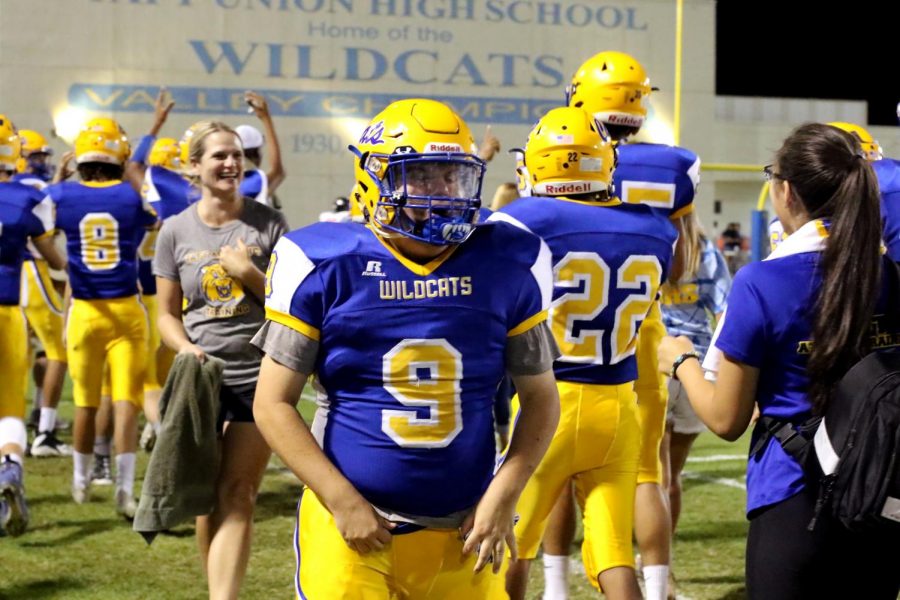 Bryson Bullard entering the sidelines at the home game on Sept. 7.  The Wildcats had just completed a touchdown.