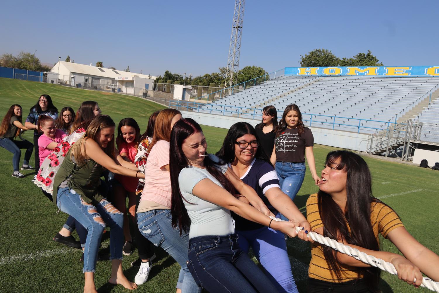 Taft High seniors participate in tug-of-war during the Day of Welcome. Cecily Bonton, Jade Gessel, and Graciela Mendoza are pictured in front.