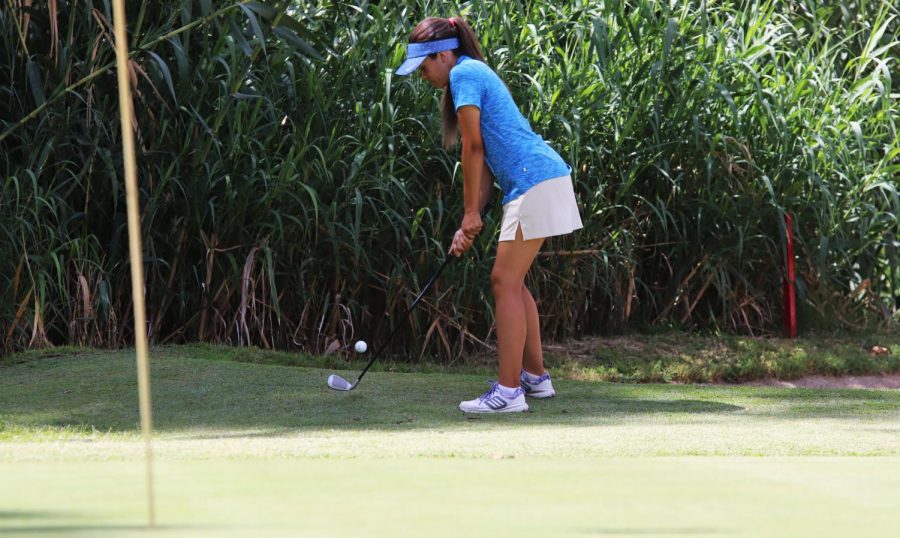 Isabella Martinez carefully chips her ball onto the green. When youre as close as she is, its safer just to putt. 
