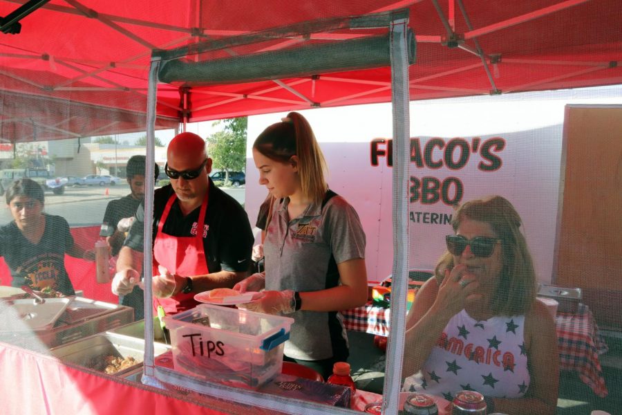 Flacos Tacos owner, Carlos Chavira and Mackenzie Zimmerli making tacos for Honor Flight fundraiser.