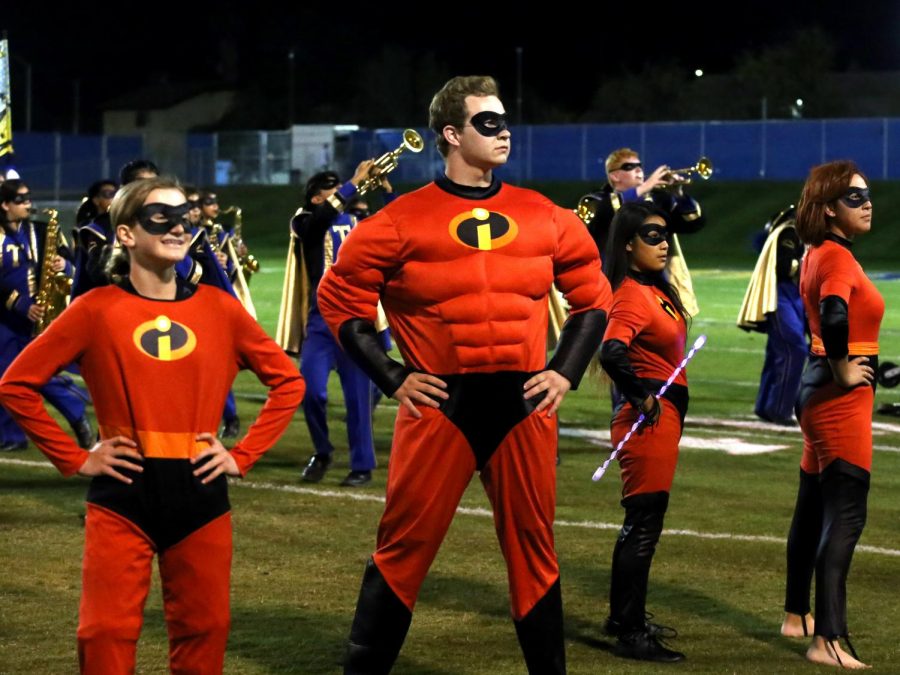 The Incredible family, Tanner Ashmore (Mr. Incredible), Reanna Rowland (Dash), Ashly Ramirez (violet), Diana Huizar (Mrs. Incredible) does their super pose. Theyre getting ready to take on Syndrome and his omnidroid in a vicious fight. Band director Amanda Posey says The Incredibles Show was a big hit and they represented Taft very well.