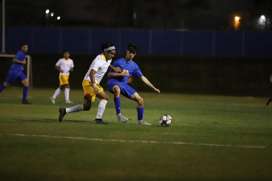 Left mid-fielder Cristobal Huizar fighting for the ball against a Shafter defender. The Wildcats fought all the way through to the final second in order to come away with the win.