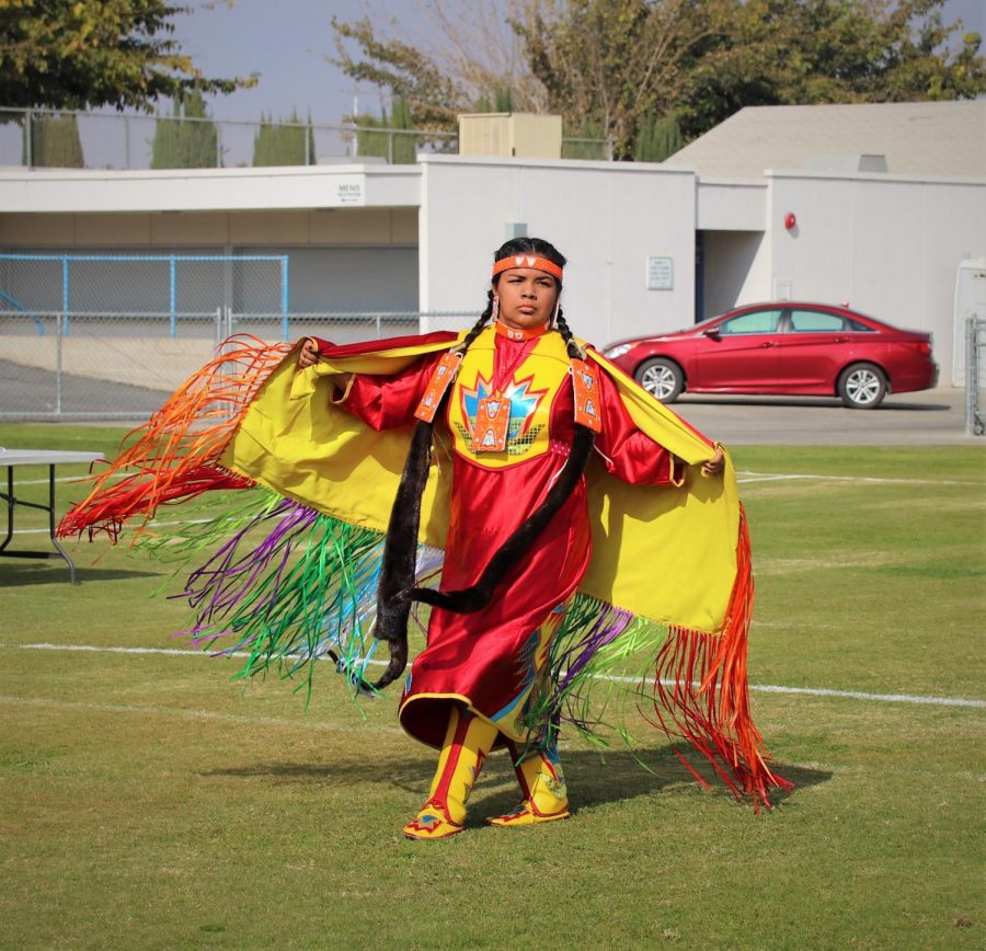 The dancers performed to the beat of the drum for the students. Representing their tribe with their colors.