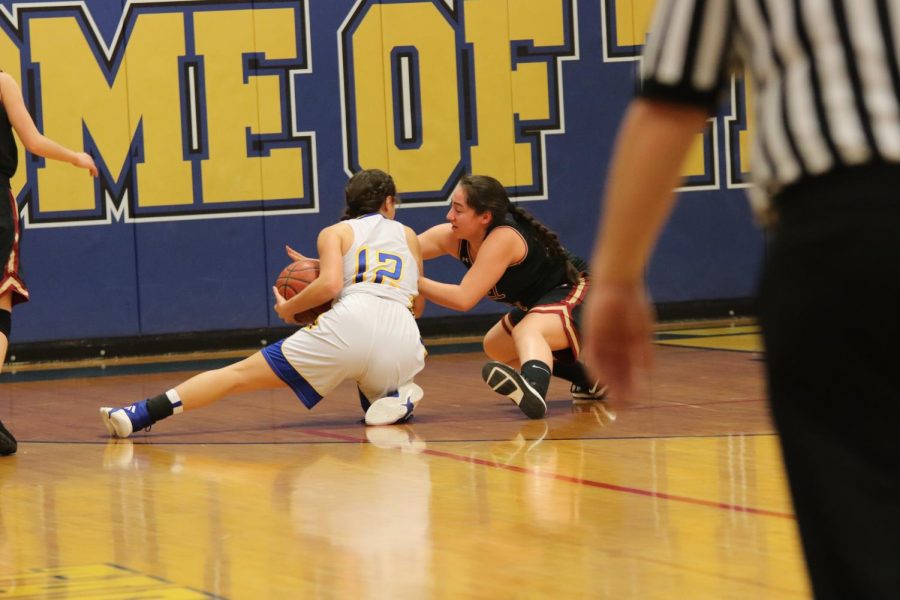 Morgan Pulido protecting the ball from an opponent. She has been playing on the varsity level for the past two years and has continued to work hard everyday. 