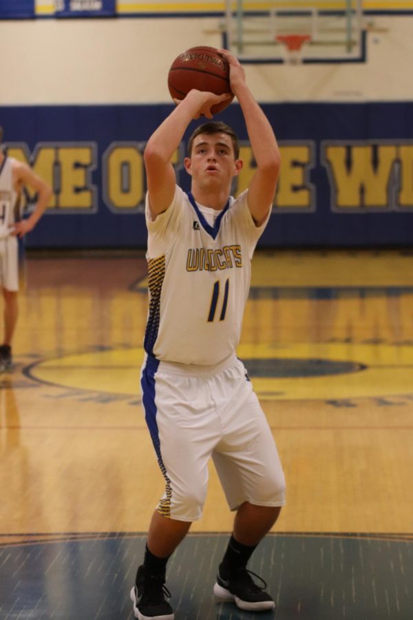 During the blowout victory for the TUHS boys basketball team, Blake Smith shoots free-throws to contribute to their win.