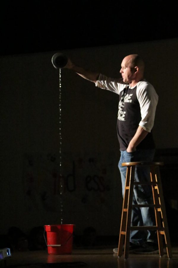 Eric Newton pouring the endless stream into the bucket below.