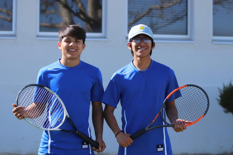 Teammates German Mejia and Marvin Gama smiling before their games. Tennis has made them become very close friends.