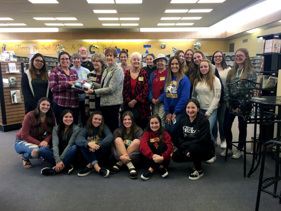 S-Club poses with members of the Soroptimist International of Taft Club while donating books about women empowerment.