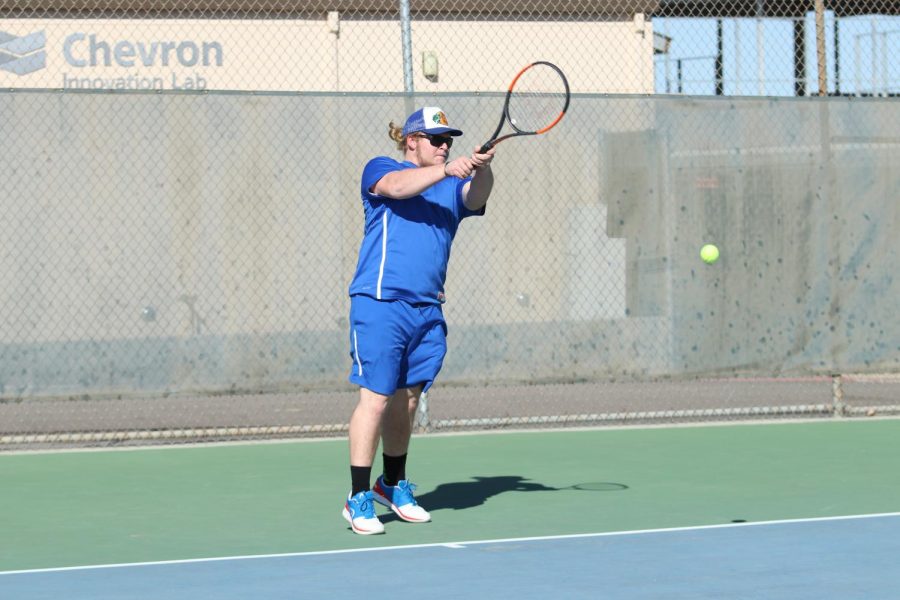 Senior Bryson Ginn returning opponents serve. Bryson had a great season this year in both singles and doubles.