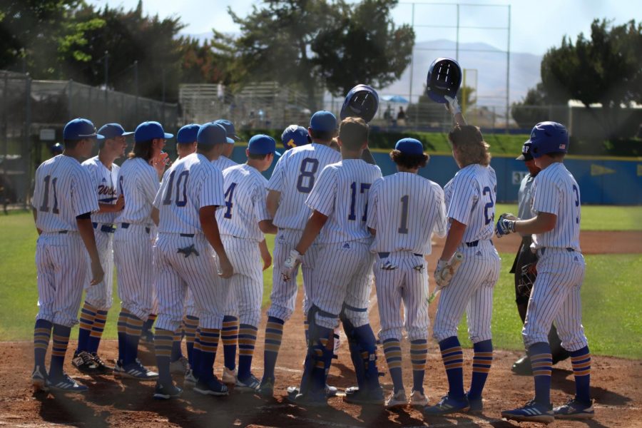 The entire team running out to congratulate Skyler Self on his out of the park home run. 