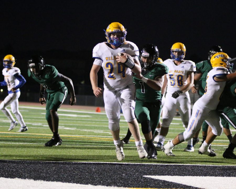 Sophomore Running back Bryce Veach (#24) scores the touchdown for TUHS. 