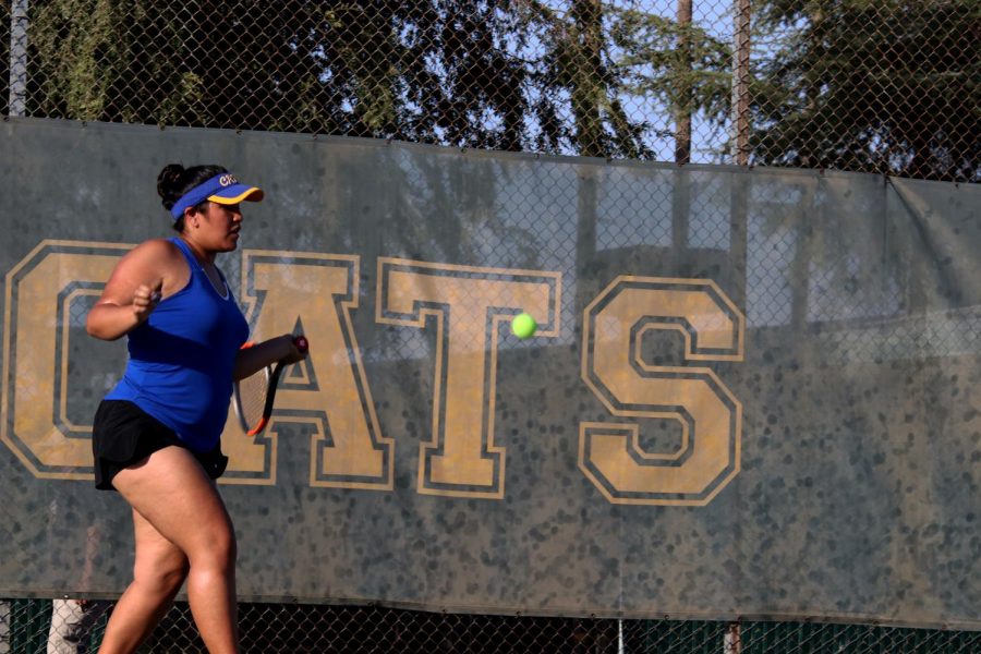 Gabriela Aguliar returning a forehand during her doubles match.