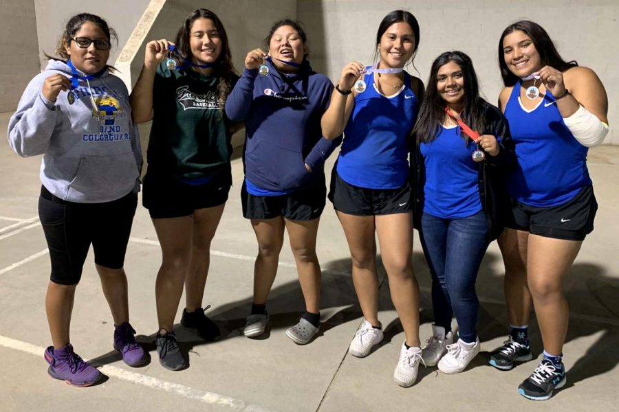 The varsity girls showing off their medals. (Jessica De La Cruz & Jeidy Perez on the left, Valerie Munoz & Cindy Perez in the middle, Arelie Paz & Gabriela Aguilar on the right). 