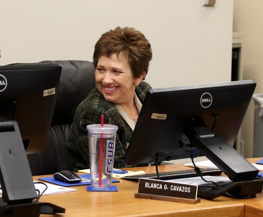 Cavazos smiling at a board meeting last year.