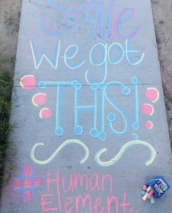 Human+Element+student+spreading+love+with+an+encouraging+message.