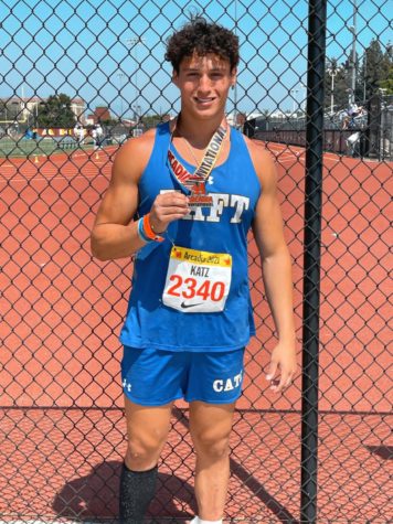 Ilan Katz showing off his second place award in mens shot put at the Arcadia Invitational on May 8th